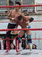 crew_cut crowd fight pose:standing shirtless short_hair sport squared_circle subject:human tagme type:photograph wrestler wrestling // 2000x2667 // 639KB