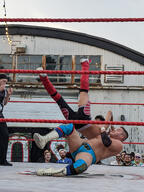 crew_cut crowd fight pose:falling shirtless short_hair sport squared_circle subject:human type:photograph wrestler wrestling // 2000x2667 // 632KB